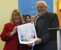 Sue Highton presents cartoon to John Stevenson